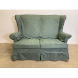 A Parker knoll semi wing back two seater sofa. MK3 model.W:130cm x D:80cm x H:94cm