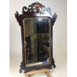 A Regency pier mirror with mahogany fret decoration and gilt gesso mouldings with gilt eagle to top.