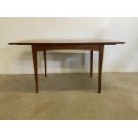 A mid century teak extending dining table by Vesper furniture.W:148cm x D:81cm x H:75cm