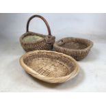 Two rattan baskets one with bent wood handle also with a wicker bread basket. Bent wood handle H: