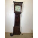A late 19th early 20th century mahogany long case clock, white face with painted spandrels,