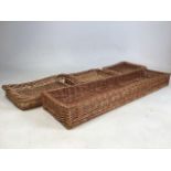 Four wicker bread baskets. W:103cm x D:24cm x H:10cm