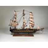 A wooden model of 18th century Spanish frigate Fragata Espinoza. On metal stand with faux snake skin
