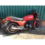 A 1982 Kawasaki GPz550 registration number HCL 85LY, red. This large sports bike has been in dry