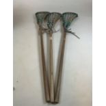 Three lacrosse sticks, tow with Hattersleys labels . Longest stick 110cm