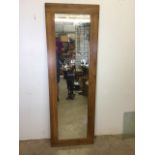 A large modern oak framed mirror. W:60cm x H:180cm.