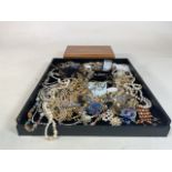 A collection of costume jewellery together with a wooden jewellery box