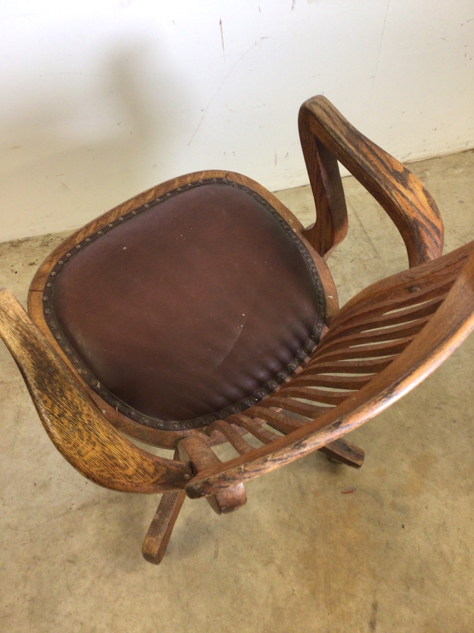 An early 20th century oak captains chair with tilt and swivel action, metal mechanics to base. - Image 9 of 11