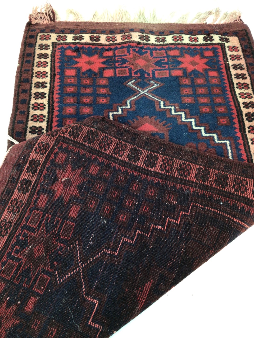 A Turkish prayer rug, maroon and navy. W:103cm x D:57cm x - Image 4 of 4