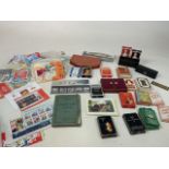 A collection of stamps and vintage playing cards - many unused