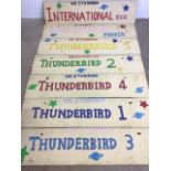Seven Thunderbirds hand painted signs on wooden boards. W:129cm x H:30cm