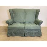 A Parker knoll semi wing back two seater sofa. MK3 model. W:130cm x D:80cm x H:94cm