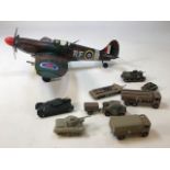 A painted metal MK 9 Spitfire model together with eight plastic vehicles W:41cm x H:12cm