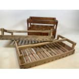 A pair of vintage French fruit racks with carrying handles together with a wine box printed Les