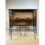 A Franco Albini mid century wicker and iron bar and two bar stools. Bar has two teak shelves to