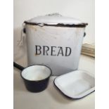 An enamel bread bin, a pan and dish. W:35cm x D:23cm x H:34cm