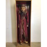 A life size Burmese marionette of a wizard in silk dress. In wooden case. With automaton eyes and