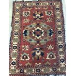 A Persian Hamadan rug with terracotta ground surrounded by a large cream border. W:173cm x H:120cm