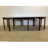 A Victorian mahogany extending dining table with four brass clips. W:259cm x D:117cm x H:72cm