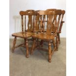 Four hardwood kitchen chairs to include one carver.