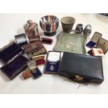 A collection of empty jewellery boxes, lighters, gilt badges, Victorian crumb tray, a belt and