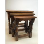 An oak nest of three tables. W:55cm x D:35cm x H:48cm