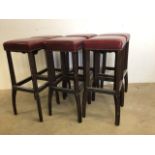 Six pub style leather bar stools with metal re enforced stretcher bars and splayed legs. With