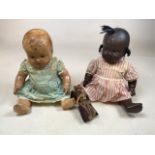Two mid century composition dolls with a miniature doll together with a china dolls tea set