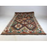 A Chobi Kilim rug. W:86cm x H:122cm