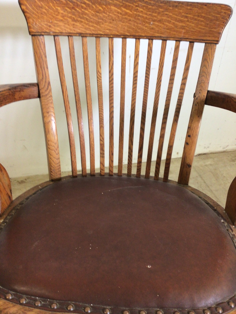 An early 20th century oak captains chair with tilt and swivel action, metal mechanics to base. - Image 7 of 11