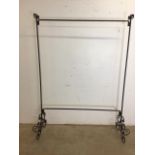 A black painted heavy metal hanging rail. W:129cm x D:45cm x H:184cm