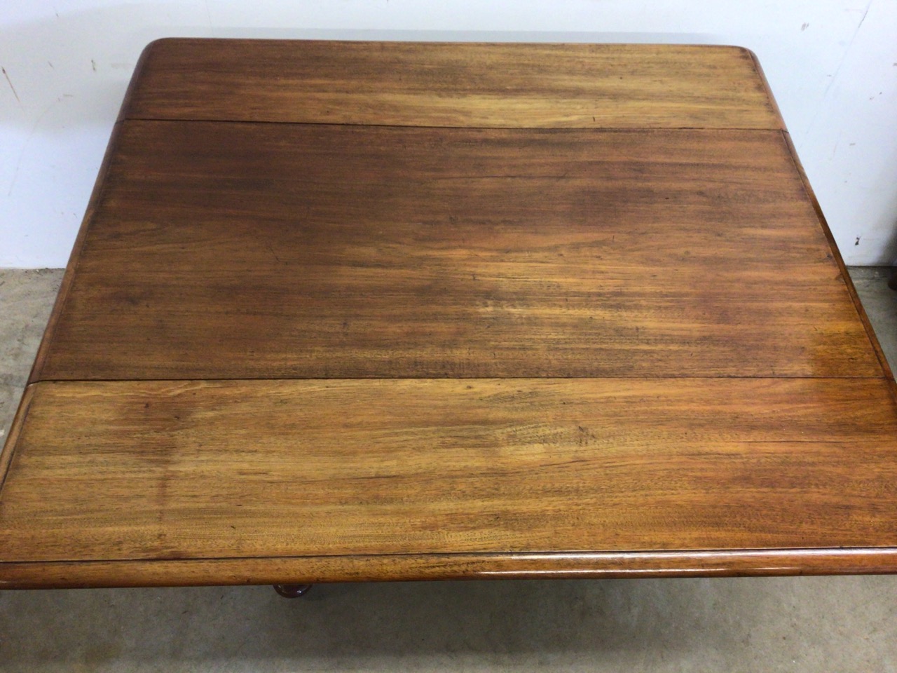 A Victorian Pembroke table with drop leaf sides, pedestal base with turned feet on metal castors. - Image 2 of 6