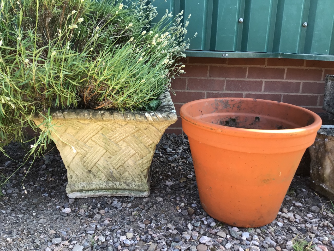 A large square planter also with a terracotta plant pot. W:48cm x D:48cm x H:36cm