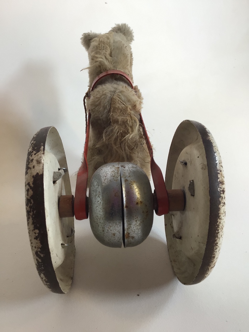 A mid century 1950-60s push along horse with tin wheels. W:36cm x D:14cm x H:20cm - Image 4 of 6