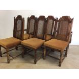 A set of six rattan backed dining chairs to include two carvers.