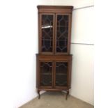 An inlaid Edwardian two piece corner cupboard each section with double doors to shelves W:70cm x D: