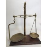 A set of brass post office scales. With original Toddâ€™s scale works label. H:43cm