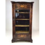 A Gillows style rosewood music cabinet with extensive inlay, glazed door to material lined