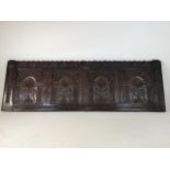 A late seventeenth early eighteenth century carved oak panel W:145.4cm x H:47.5cm x D:2.1cm