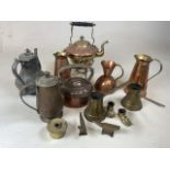 A collection of copper and brass items to include a kettle on stand