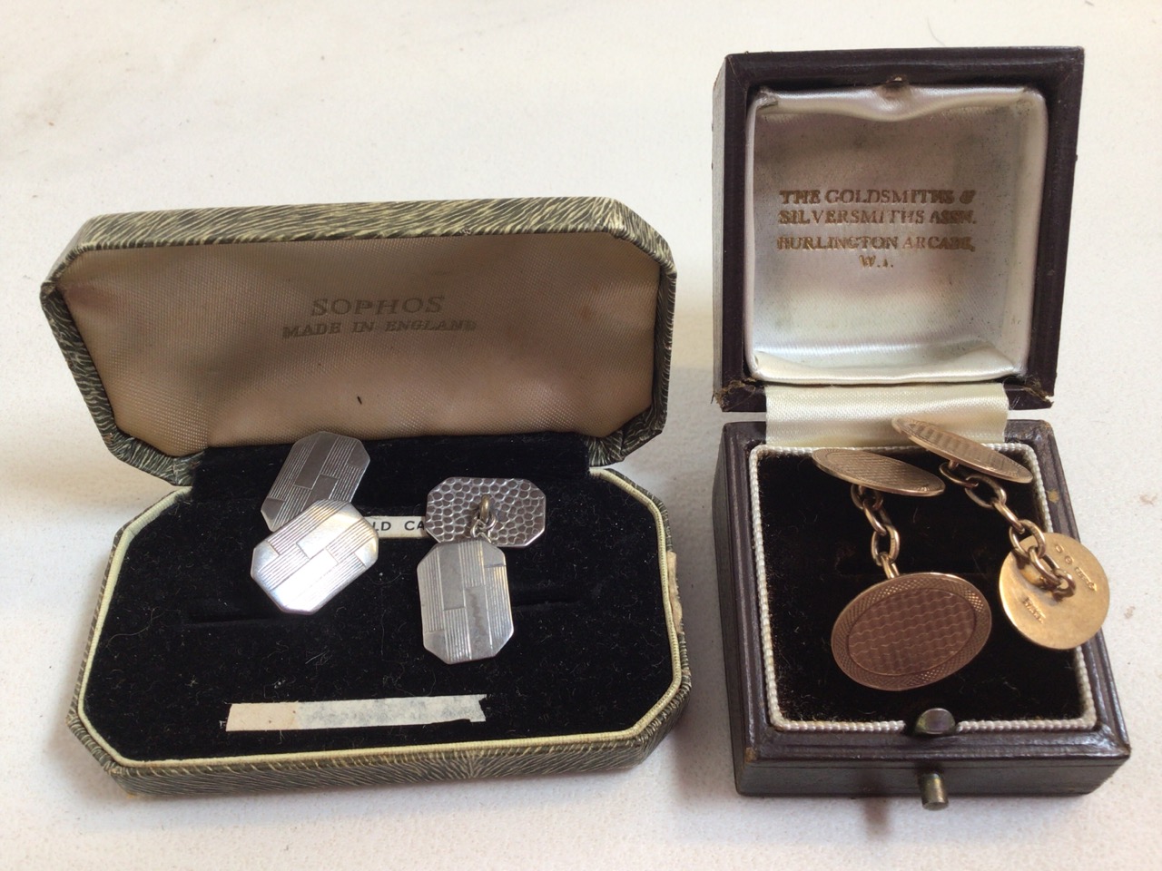 A pair of 9ct gold cufflinks 7.8 grams also with sa pair of silver coloured cufflinks.