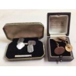 A pair of 9ct gold cufflinks 7.8 grams also with sa pair of silver coloured cufflinks.