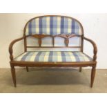 A two seater salon settee. With reeded tapered legs. W:110cm x D:55cm x H:100cm