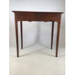 Small antique Georgian style side table with tapered legs with large central drawers and brass