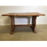 A rustic single plank top country style dining table with wide stretcher bar to base. 1.5 inch thick