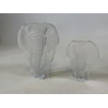 Two Mats Jonasson Swedish frosted glass elephant paperweights signed. The largest 20cm high x 16cm