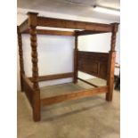 A large modern four poster bed. W:183cm x D:206cm x H:210cm