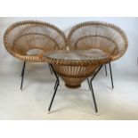 A Franco Albini mid century circular coffee table in wicker and metal with glass top and two