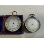 Two brass compensator barometers one cased.