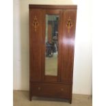 An inlaid single wardrobe with bevelled mirror door with deep drawer base. W:86cm x D:42cm x H: